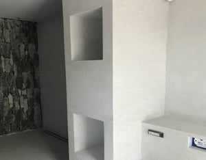 A bathroom with a white background
Description automatically generated